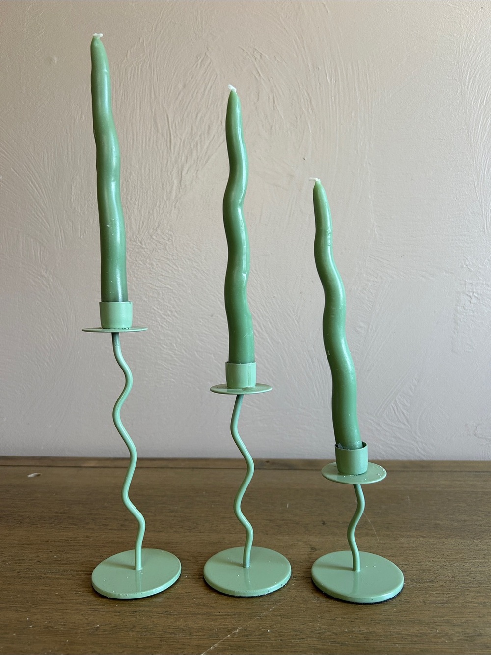 Metal Sage Green Wavy Candle Holders With Matching Color Squiggle Taper Candles.